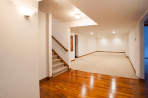 finished basement with carpet and hardwood flooring mix